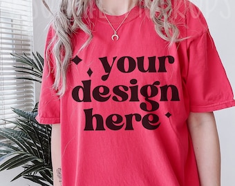 May include: A red t-shirt with the text "your design here" in black.
