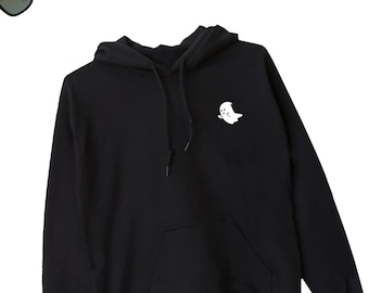 May include: Black hooded sweatshirt with a white ghost graphic on the front.