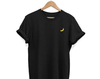 May include: A black t-shirt with a small yellow banana embroidered on the front.
