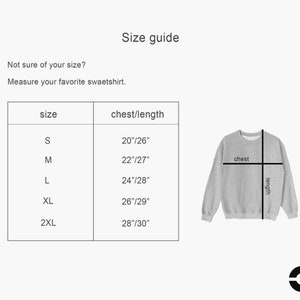 May include: Size guide for a sweatshirt with measurements in inches for chest and length. Sizes include S, M, L, XL, and 2XL.