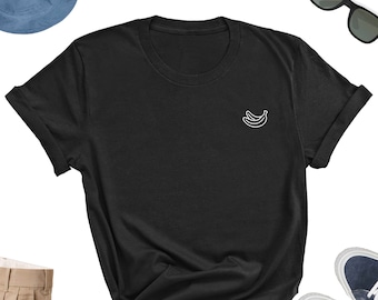 May include: Black short-sleeved t-shirt with a white outline of two bananas on the left chest.
