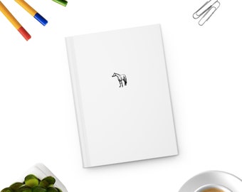 May include: A white notebook with a black line drawing of a horse on the cover.