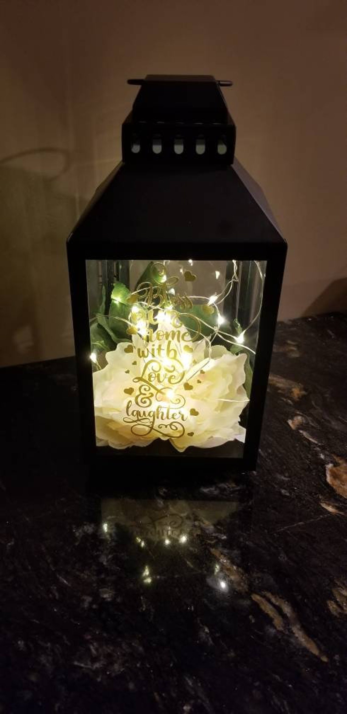 Lantern Centerpiece with Fairy lights with floral decor on the Etsy