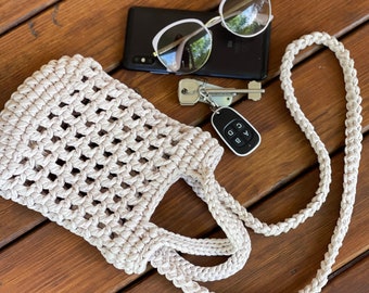 A small handbag, fashionable and comfortable knitted from knitted yarn.