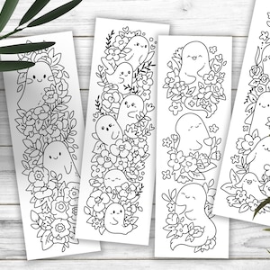 May include: Four black and white printable bookmark designs featuring cute ghost illustrations surrounded by floral patterns.