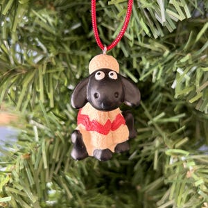 Shaun the sheep. Wallace and Gromit. 1989. Christmas decoration. Kitsch Christmas decoration. Kitschmas. Christmas tree decoration.