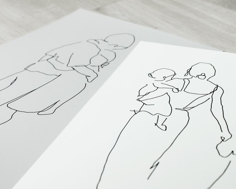 May include: Two line drawings of people. The first drawing shows a person holding a child. The second drawing shows a person holding a child on their hip.