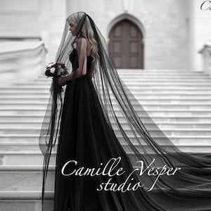 Dramatic long black bridal veil with blusher