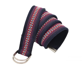 May include: A navy blue belt with a red, white, and blue geometric pattern. The belt has a silver double D-ring buckle.