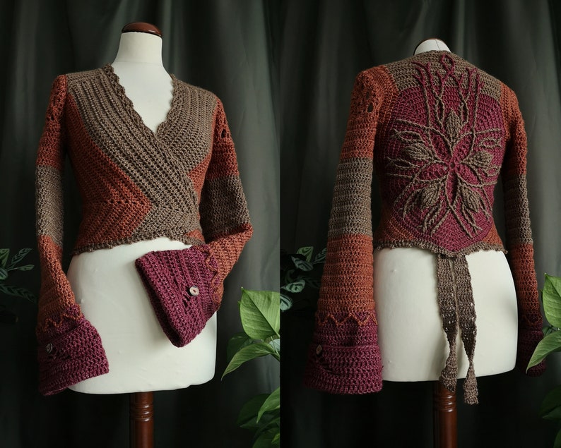 May include: A crocheted wrap cardigan with long sleeves and a tie closure. The cardigan is made in a brown, orange, and burgundy color scheme. The back of the cardigan features a large crocheted flower design.