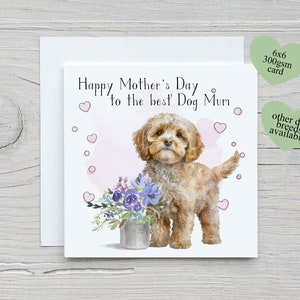 May include: A greeting card featuring a watercolour illustration of a brown and white dog holding a bouquet of purple flowers in a metal bucket. The card reads "Happy Mother's Day to the best Dog Mum".