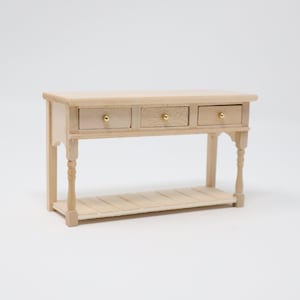 May include: A wooden console table with three drawers and a lower shelf. The table is unfinished and has a natural wood colour.