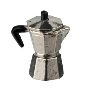 May include: A silver-colored stovetop espresso maker with a black handle and top knob. The coffee pot has a classic octagonal design and is made of metal. The handle is curved and the knob is round.
