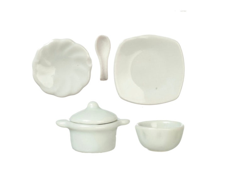 May include: A set of white ceramic miniature kitchenware, including a small pot with a lid, a bowl, a plate, and a spoon.