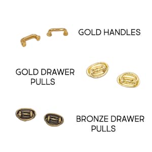 May include: Gold drawer pulls and handles. Two gold drawer pulls are shown, one with a simple design and the other with a more ornate design. Two gold handles are also shown, both with a simple design.