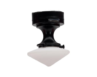 May include: Black ceiling light fixture with a white, cone-shaped glass shade.