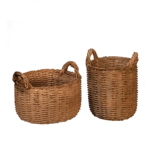 May include: Two brown woven wicker baskets. One is a low, round basket with two handles. The other is a taller, cylindrical basket with two handles. Both baskets are made of natural-colored wicker.