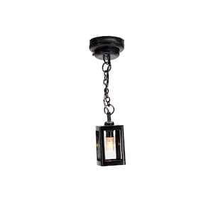 May include: Black metal pendant light with a square glass shade and a chain hanging from a ceiling mount.