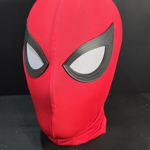 May include: Red Spiderman mask with black eye frames and mesh eye coverings. The mask is made of a smooth, stretchy material and is designed to cover the entire head. A costume accessory.