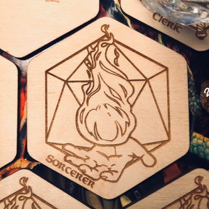 May include: A wooden token with a geometric design and a flame illustration. The token says "Sorcerer" at the bottom.