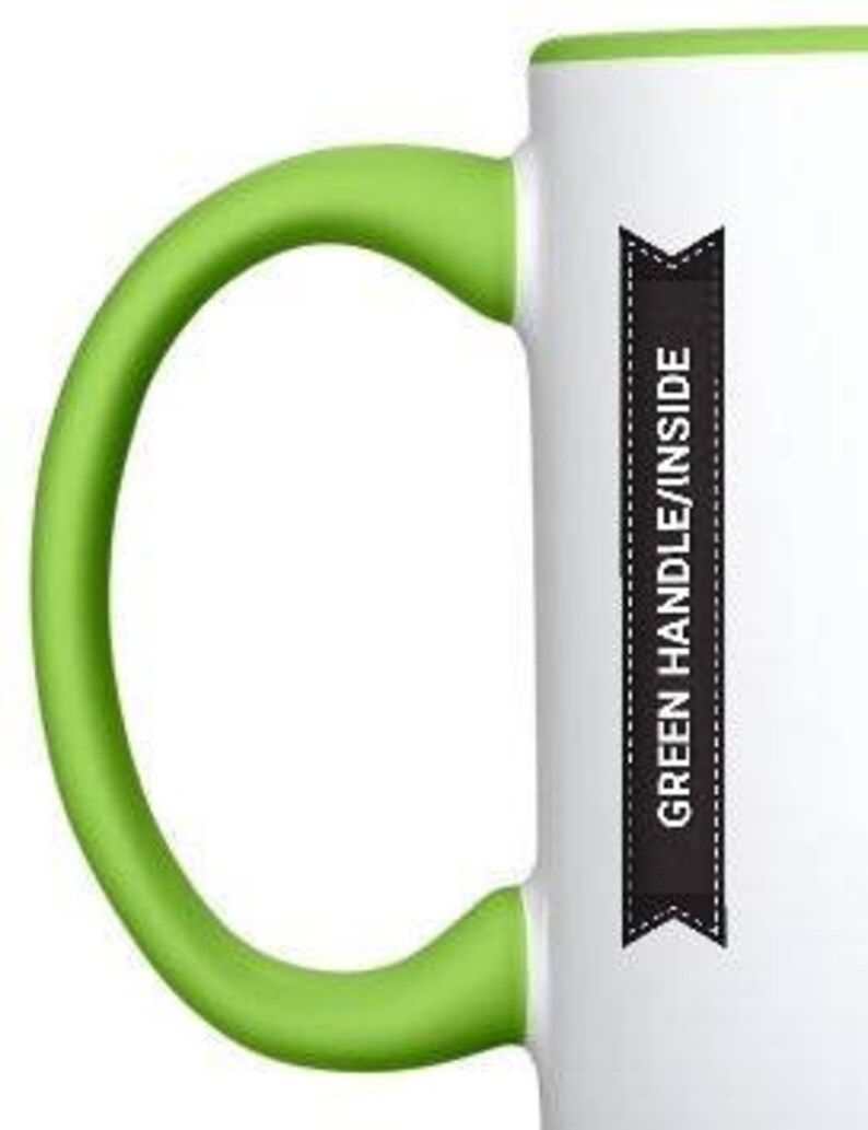 May include: White ceramic mug with a green handle and green rim. The mug has a black banner on the side that says "GREEN HANDLE/INSIDE".