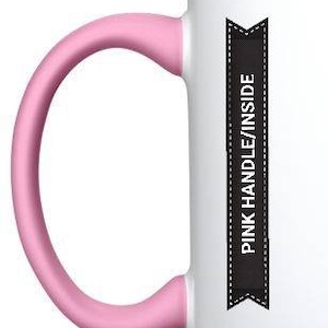 May include: White ceramic mug with a pink handle and rim. The mug has a black banner with the text "PINK HANDLE/INSIDE" printed on it.