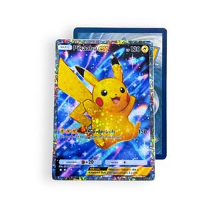 May include: A holographic Pikachu EX trading card featuring a yellow character with red cheeks against a blue, star-filled background. The card displays the text Pikachu EX, 120 HP, Thunderbolt, and includes game rules and energy symbols.