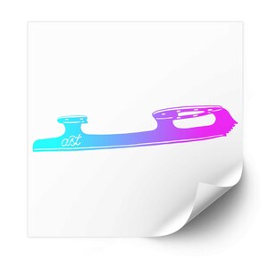 May include: A sticker featuring a gradient ice skate blade silhouette transitioning from cyan to magenta. The blade includes a mounting plate, a heel support, and the lowercase text "ast" in a white script font on the front section.