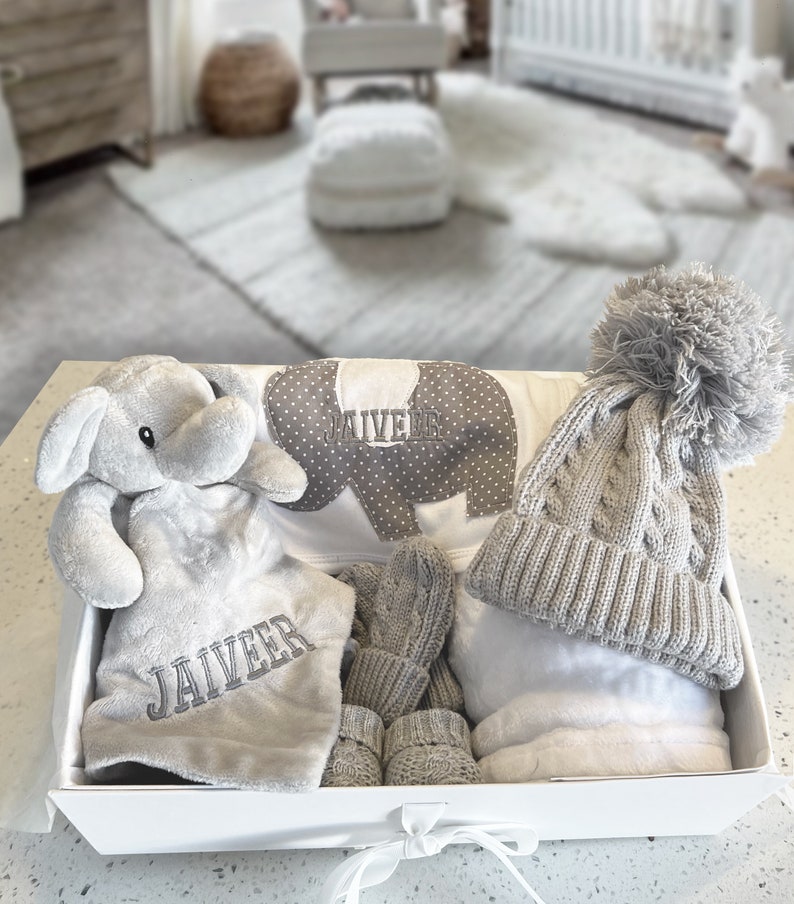 Personalised Baby Gift Set, cosy elephant comforter, bib, a soft blanket, knit hat, mittens and booties. Baby shower gift, baby gift, welcome baby items, baby gift ideas, personalised baby gift ideas