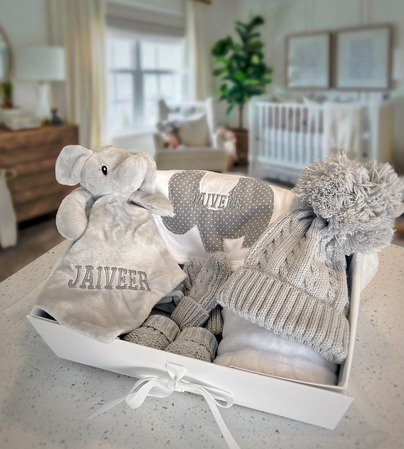 Personalised Baby Gift Set, cosy elephant comforter, bib, a soft blanket, knit hat, mittens and booties. Baby shower gift, baby gift, welcome baby items, baby gift ideas, personalised baby gift ideas