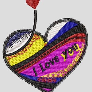 May include: A colorful embroidered heart with the words "I Love You" in black lettering. The heart is decorated with black, white, red, yellow, blue, and pink thread.
