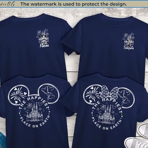May include: Navy blue t-shirts with white graphics. One shirt has "Noah" and a castle design, the other "Sophia". The back of the shirts say "The Happiest Place on Earth" with a castle and Mickey Mouse ears.