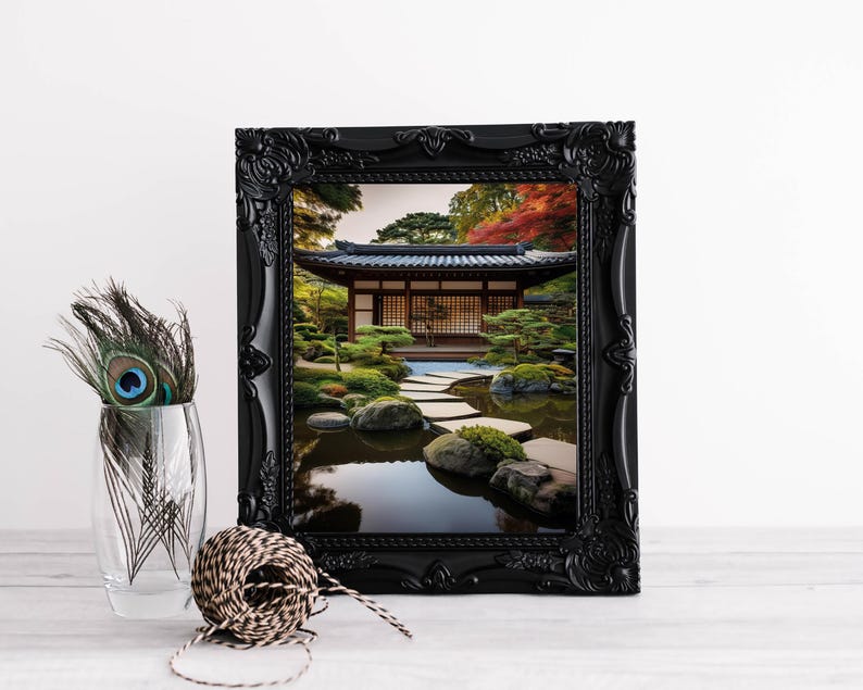 May include: A black framed print of a Japanese garden with a wooden building, a pond, and a stone path. The garden is surrounded by trees and bushes.