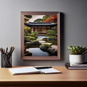 May include: A framed photograph of a Japanese garden with a wooden building, a pond, and a stone path. The garden is filled with lush greenery and colorful foliage.