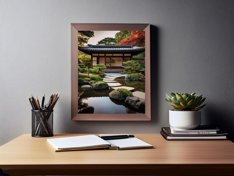 May include: A framed photograph of a Japanese garden with a wooden building, a pond, and a stone path. The garden is filled with lush greenery and colorful foliage.