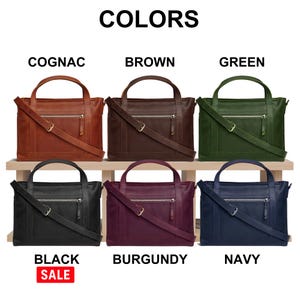 a collection of six leather handbags in various colors, including cognac, brown, green, black, burgundy, and navy, arranged on a wooden shelf.