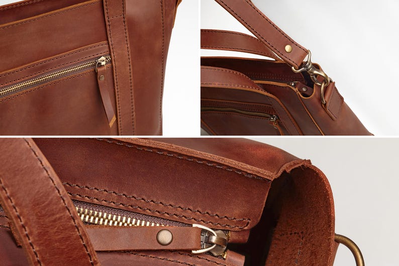 A close-up view of a brown leather handbag, showcasing its detailed features such as the zipper, straps, and hardware.