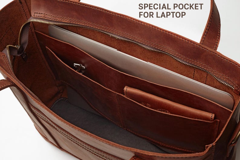 a brown leather tote bag with a laptop compartment inside, which is labeled as a "Special Pocket for Laptop".