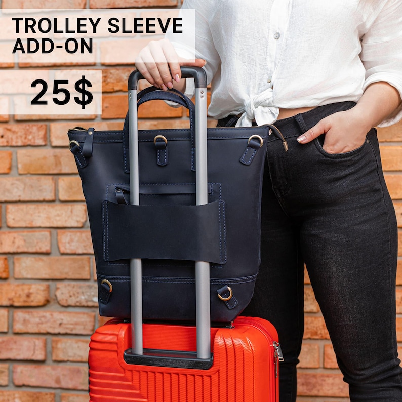 a woman holding a piece of luggage in her hand