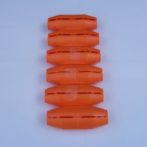 May include: Six orange plastic cable connectors stacked vertically on a white background.