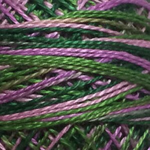 May include: A spool of embroidery floss with a variegated green and purple color scheme. The floss is wound tightly and has a smooth, shiny finish.