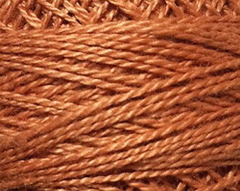 May include: A skein of orange embroidery floss.