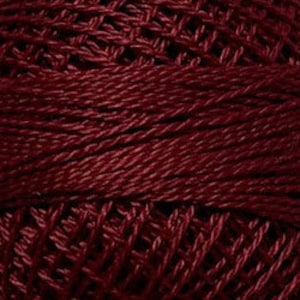 May include: A spool of deep red embroidery floss.