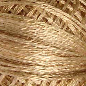 May include: A spool of beige embroidery floss.