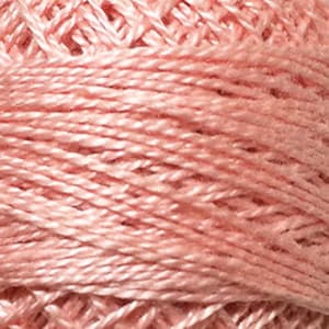 May include: A spool of pale pink embroidery floss.