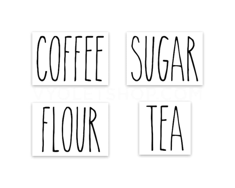 May include: Four white labels with black handwritten text. The labels read "COFFEE", "SUGAR", "FLOUR", and "TEA".