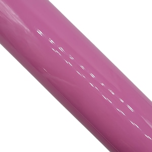 May include: A close-up of a smooth, glossy, pink vinyl sheet.