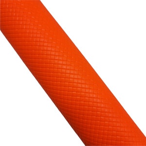 May include: A roll of orange material with a textured, grid-like pattern. The material is diagonally positioned against a white background. The color is a vibrant, solid orange.