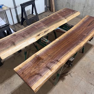 Premium live edge black walnut table tops in Ozarks Woodland shop.  These will be used for console sofa tables for behind the couch or in a hallway.
