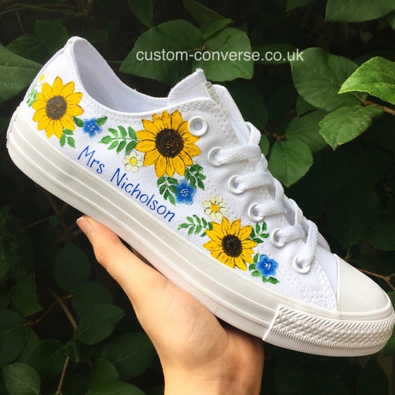 white converse with sunflowers